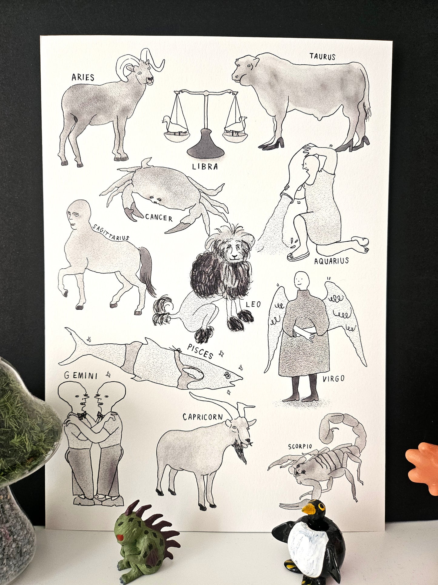 Illustration of zodiac signs with corresponding animals on a white background